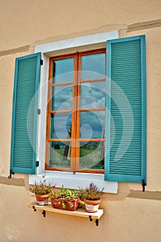 Teal Shuttered Window