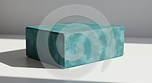 Teal Cube on White Surface