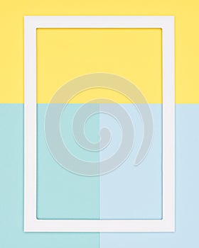 teal and yellow paper flat lay background. Minimalism, geometry and symmetry template with empty picture frame mock up.
