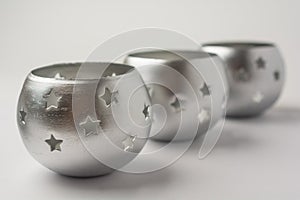 Tealight Candles with Stars on White Background Side View