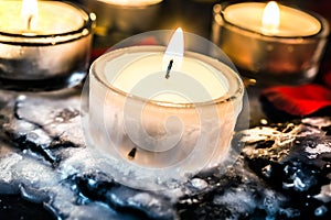 Tealights On Slate With Wax Around The Tea Light That Looks Like Ice