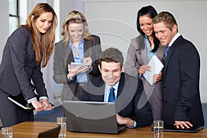 Team of 5 business people during meeting