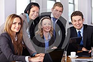 Team of 5 business people during meeting