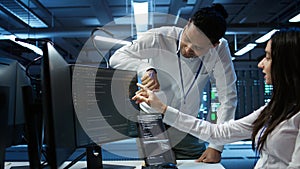 Team of admins in data center ensuring system can handle networking tasks