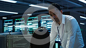 Team of admins in data center ensuring system can handle networking tasks