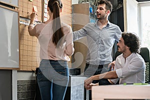 Team of agency employees in time scheduling meeting