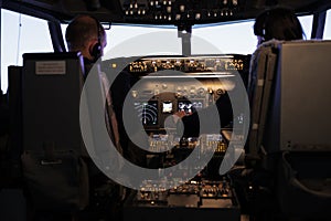 Team of aircrew members throttling engine to fly airplane