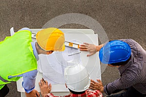 Team of Architect engineer planning group project partners meeting at building site, Construction site office teamwork concept