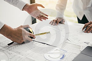 Team architect or engineering people discussion working on table together at a construction site