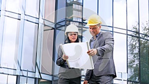 Team of architects and engineer in group on construciton site check documents and business workflow. Engineer inspection in workpl