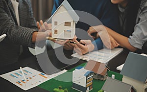 Team of architectures and businessmen discussing and brainstorming on floor plan modification for real estate investment and