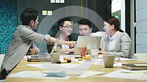 Team of asian business people working together in office