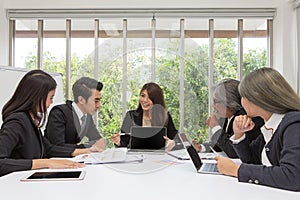 Team of asian business posing in meeting room. Working brainstorming on the table in a room. asian people. The office.