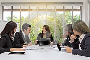 Team of asian business posing in meeting room. Working brainstorming on the table in a room. asian people. The office.