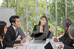 Team of asian business posing in meeting room. Working brainstorming on the table in a room. asian people. The office.