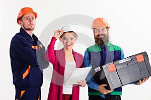Team of builders concept. Men and woman in hard hats