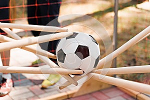 Team building game with soccer ball. People touches ball with sticks. Games for company.