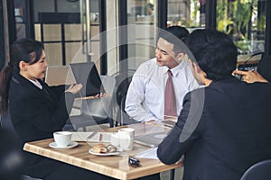 Team Business Partners shaking hands together to Greeting Start up small business in meeting room. Shakehand teamwork partners at photo