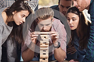 Team of business people build a wooden construction. concept of teamwork ,partnership and company startup