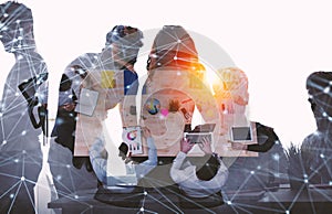 Team of businessmen work together in office. Concept of teamwork and partnership with network effect. double exposure photo