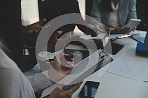 Team of business people working together in the meeting room office, teamwork background charts and graphs banner, double exposure