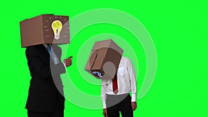 Team of businessman hiding head with box