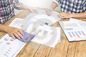 Team businessman using calculator  for calculate tax.financial  plan and analyzing investment charts in office