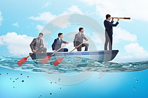 The team of businessmen in teamwork concept with boat