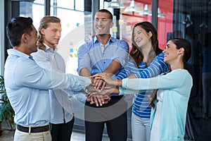 Team of businesspeople forming handstack
