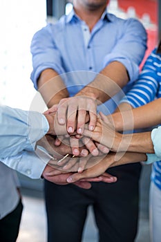 Team of businesspeople forming handstack