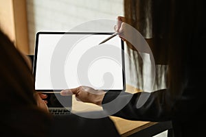 Team businesswoman working on blank screen modern tablet in office