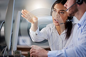 Team, call center and woman coaching man on computer for support, help or customer service training at internship