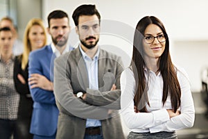 Team of cheerful businesspeople posing for group picture