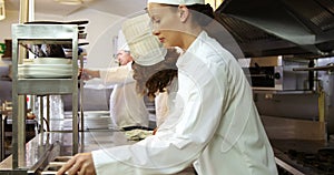 Team of chef cleaning the kitchen