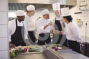 Team of chef tasting food in the commercial kitchen