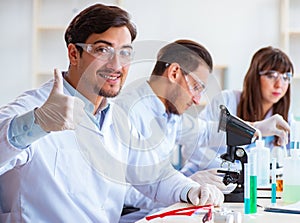 Team of chemists working in the lab