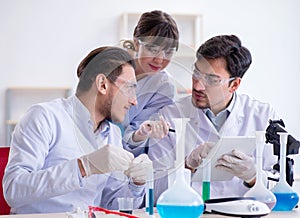 Team of chemists working in the lab