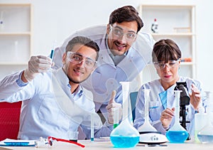 Team of chemists working in the lab