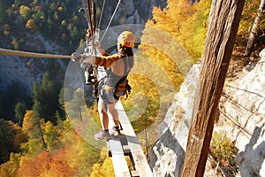 A team of climbers at the top of a high mountain in the light of the setting sun.