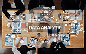 Team Collaboration on Data Analytic Strategies with Charts, Graphs, and Digital Technology in a Modern Office