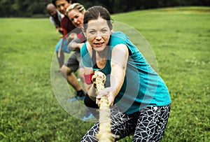 Team competing in tug of war photo