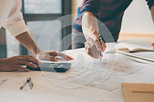 Team of Construction engineering or architect hands working on b