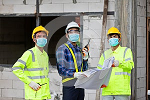 Team construction worker control in the house structure at construction site, during the spread of coronavirus
