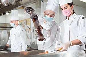 Team of cooks cooks in a restaurant