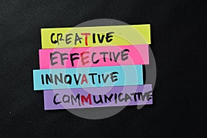 TEAM - Creative Effective Innovative Communicative write on sticky notes isolated on office desk photo