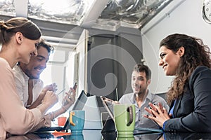 Team of creatives having meeting in agency office