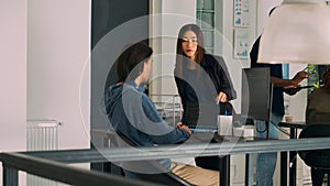 Team of database admins analyzing source code on computer monitor