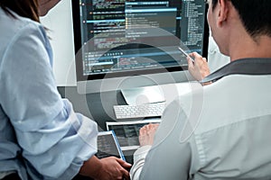 Team of Developer programmer working on coding program software computer in office, Writing website and development database