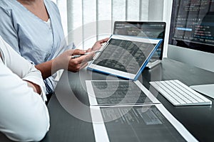 Team of Developer programmer working on coding program software computer in office, Writing website and development database
