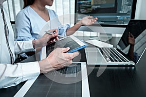 Team of Developer programmer working on coding program software computer in office, Writing website and development database